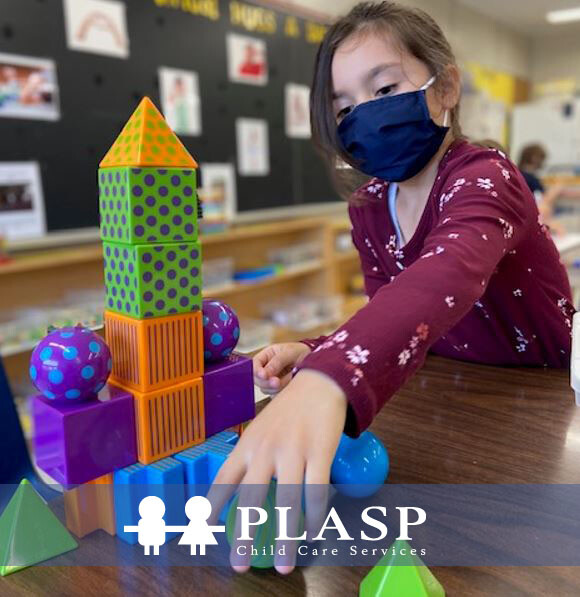 picture of a child playing with bricks with the child in plasp program